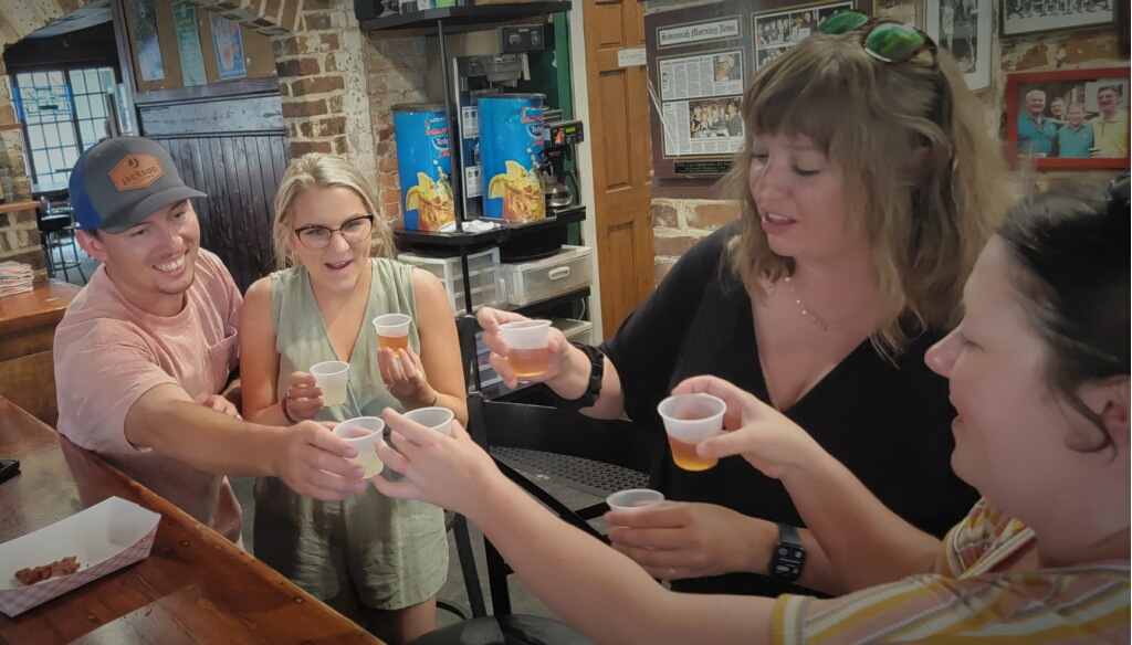 Group toasting with mad cat tours